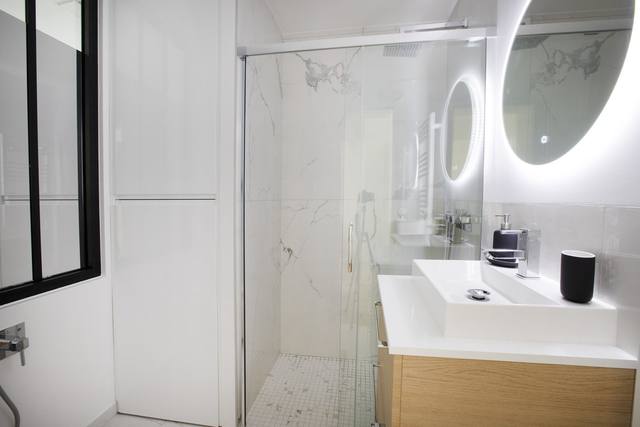 Renovated bathroom with designer shower
