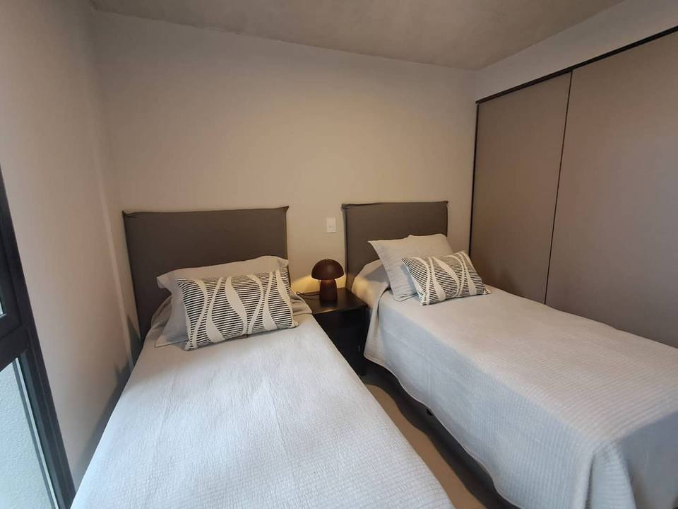 Bedroom with two single beds and closet