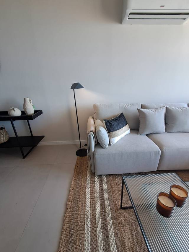 Light-colored modular sofa with cushions