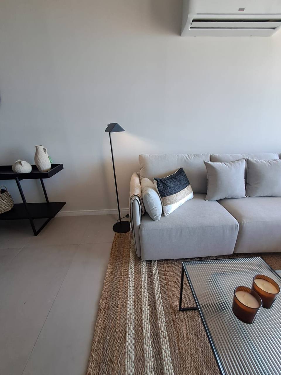 Light-colored modular sofa with cushions