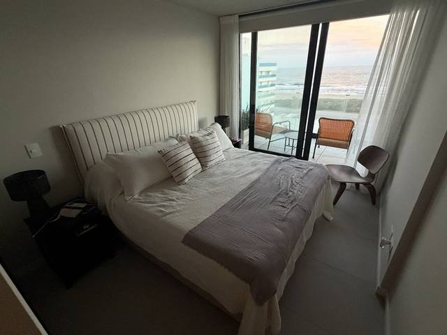 Double bed with headboard and pillows