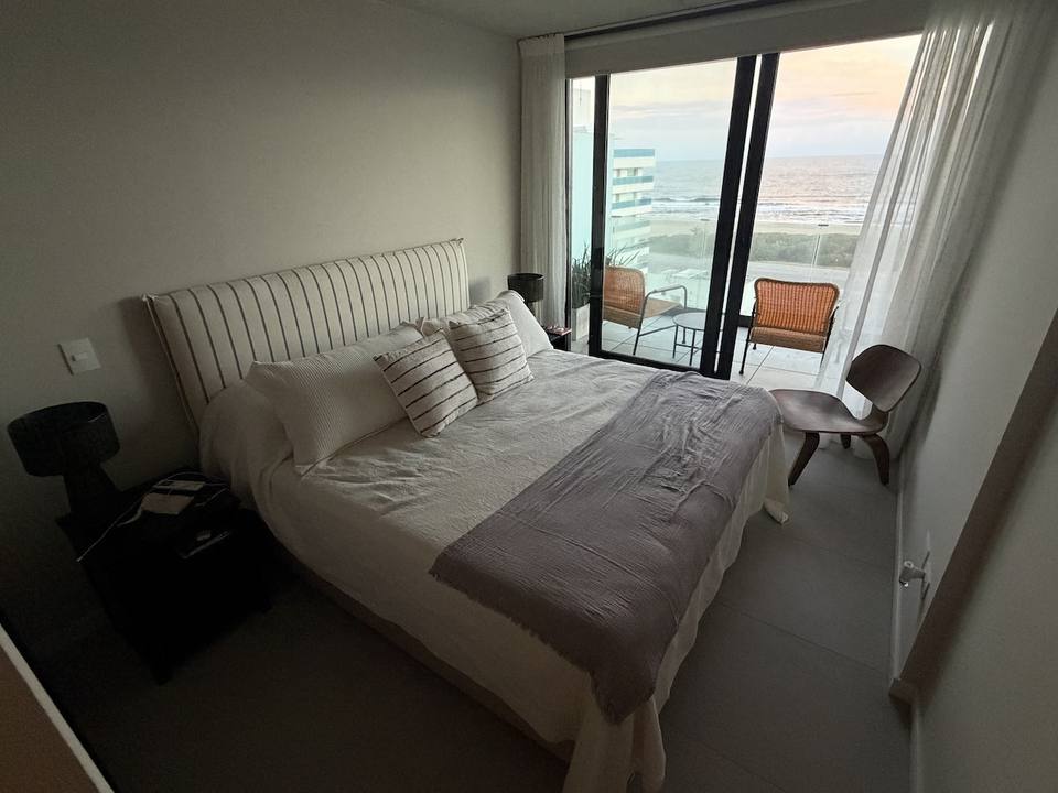 Double bed with headboard and pillows
