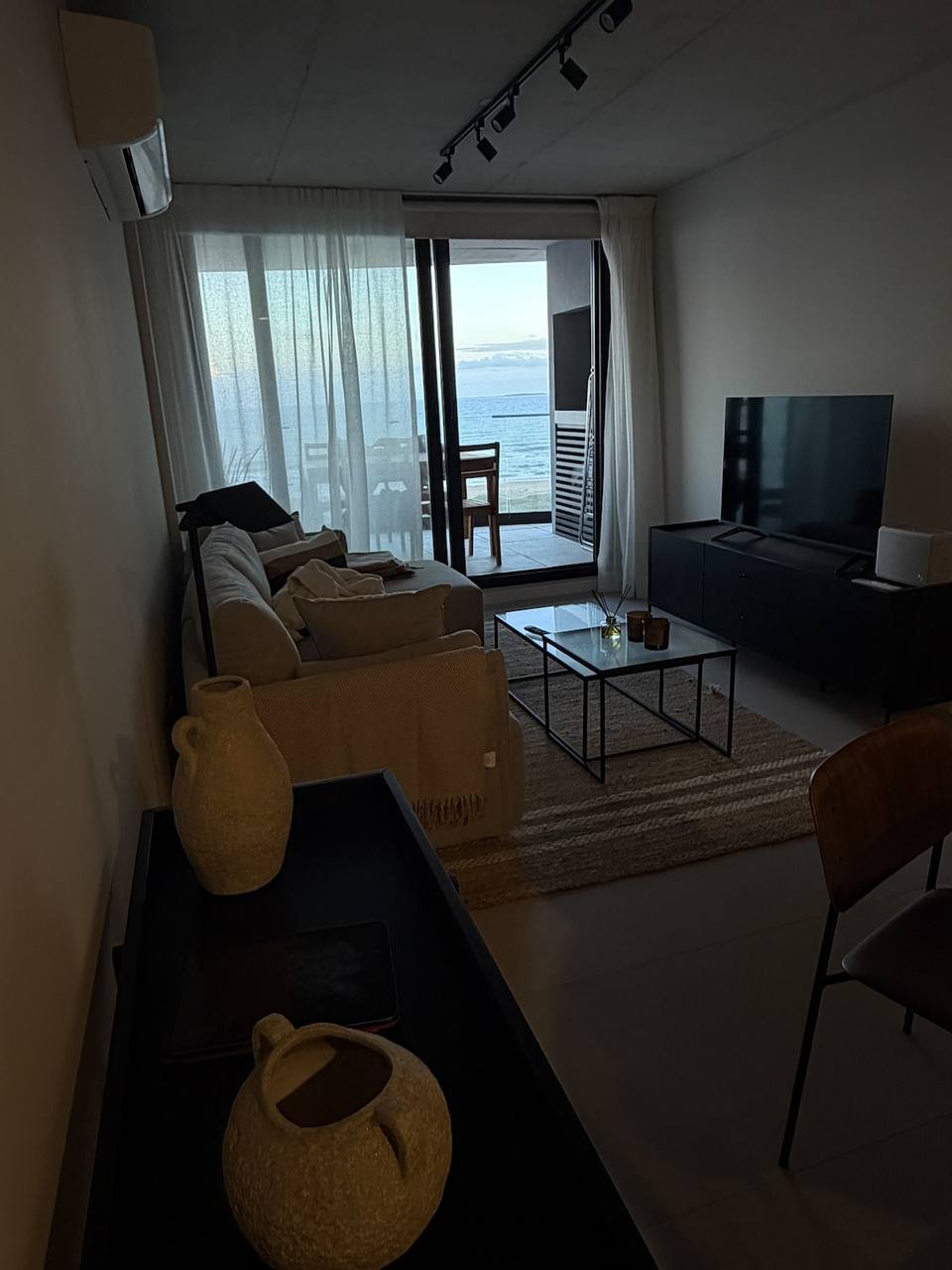 Living room with large window to sea