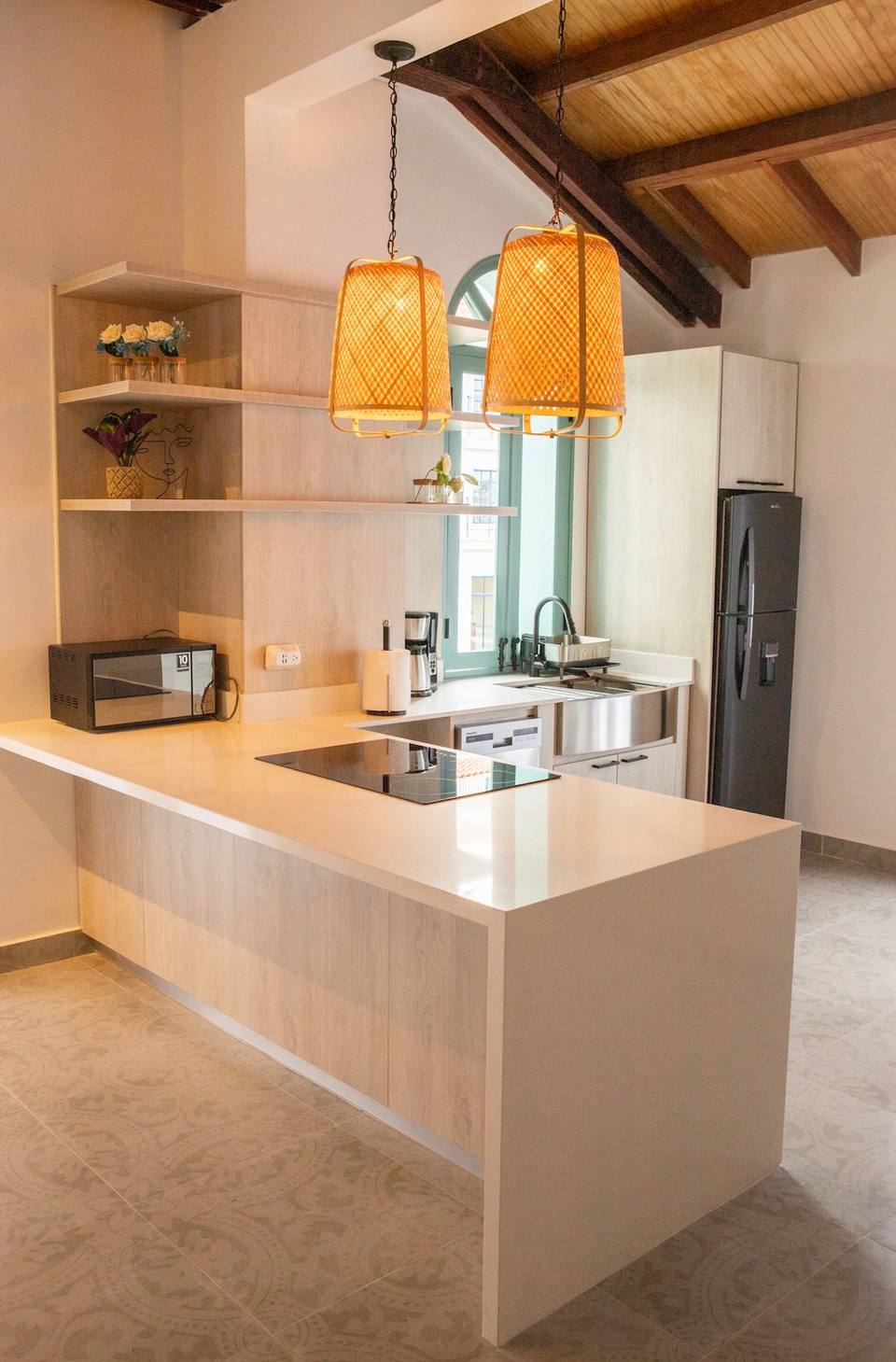 Modern kitchen with island and appliances.