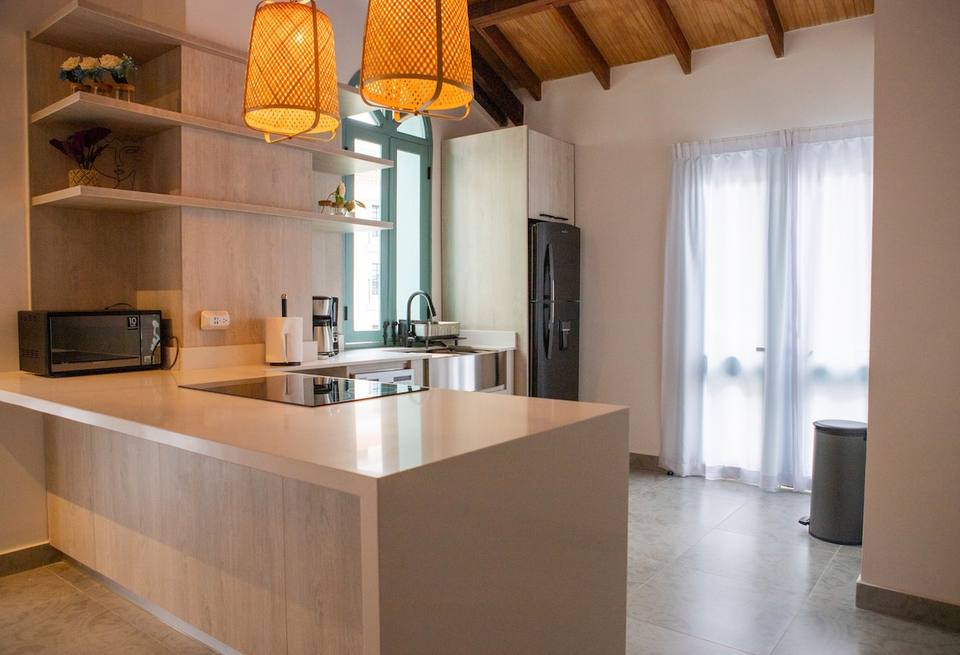 Kitchen with countertop, appliances, and shelves