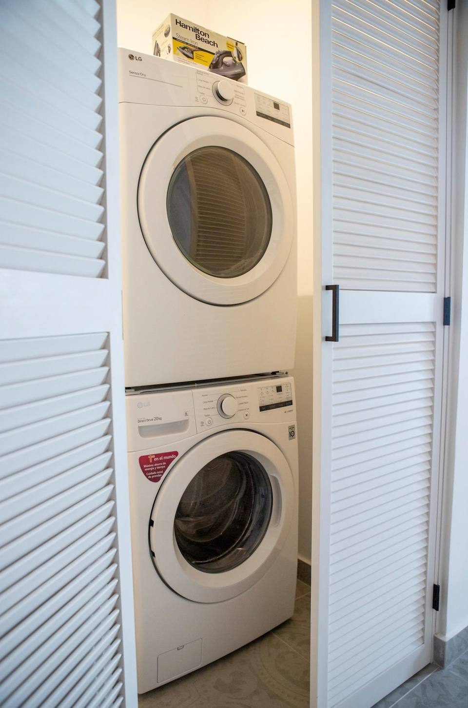 Stacked washer dryer with iron