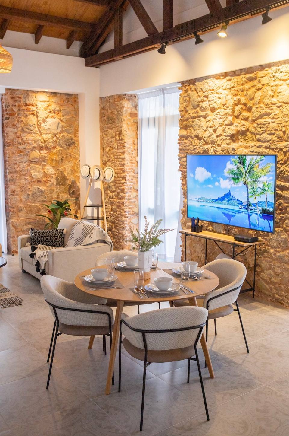 Dining table and living area with sofa