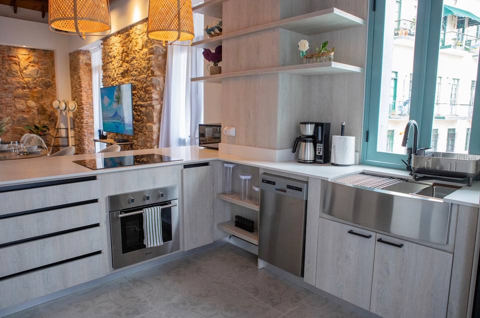 Kitchen with countertop, appliances, and shelves