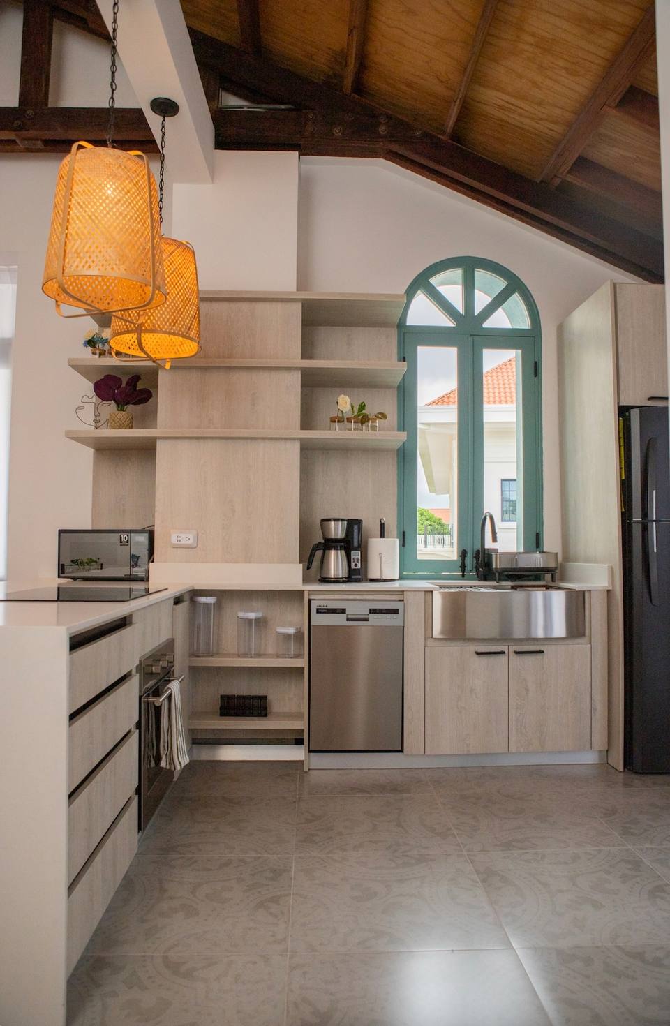 Kitchen with shelves, appliances and window