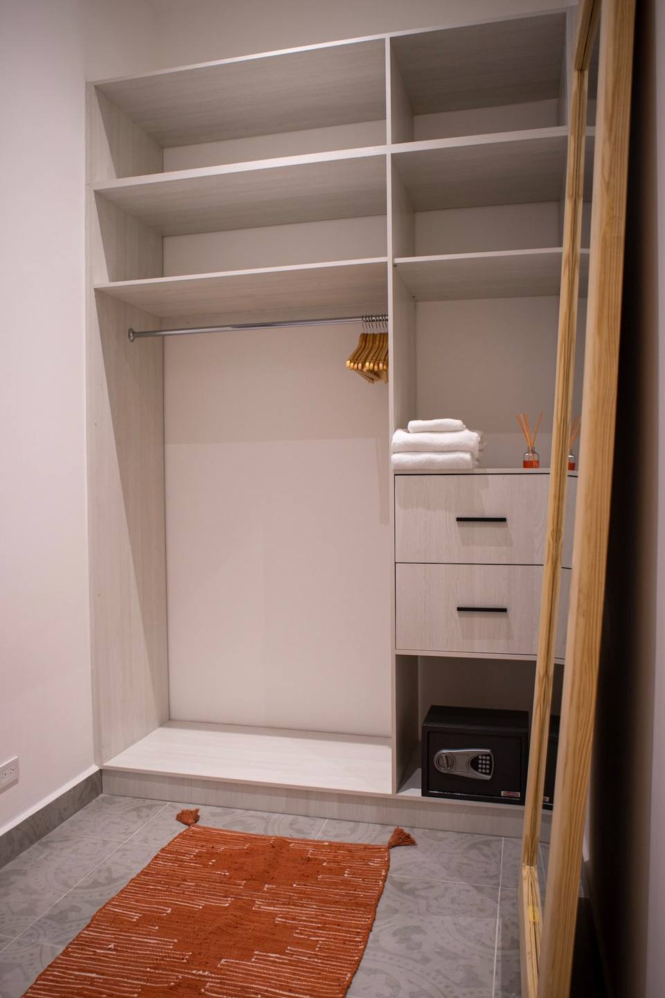 Open closet with shelves and drawers