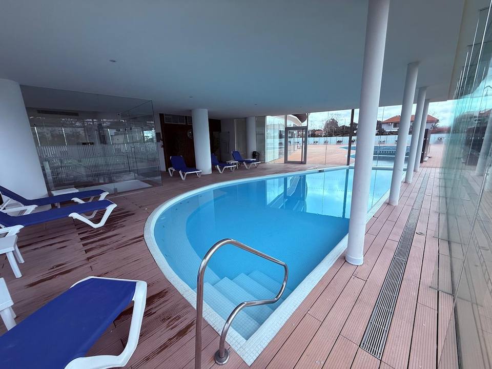 Indoor swimming pool with wood floor