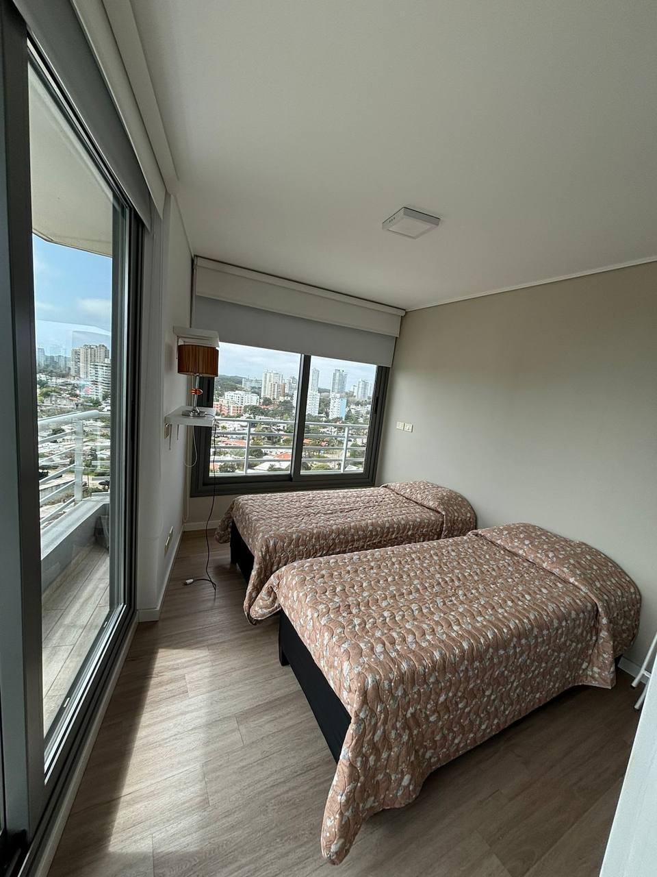 Bedroom with two single beds and view