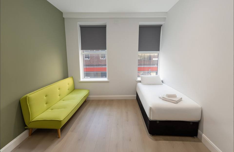 Additional seating area with sofa and single bed