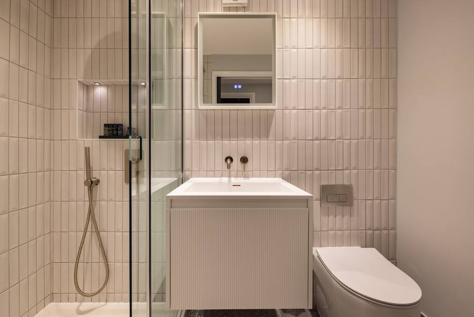 Modern bathroom with rain shower and luxury finishes
